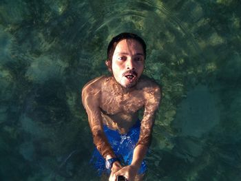 Young woman swimming in sea