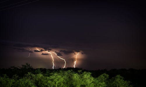 Scenic view of lightning in sky at night