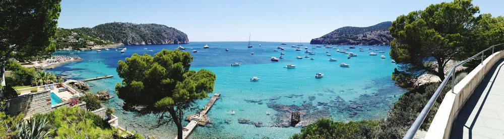 High angle view of sea against clear blue sky