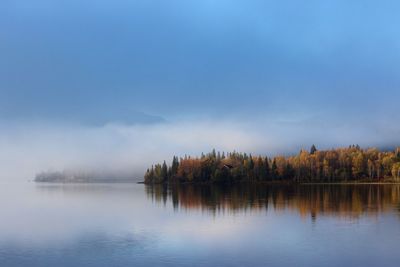 Scenic view of lake against sky during autumn