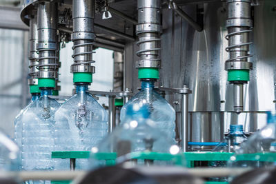 Low angle view of bottles in factory