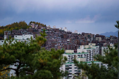 Buildings in city against sky