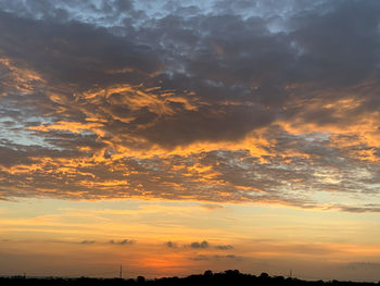 Low angle view of dramatic sky during sunset