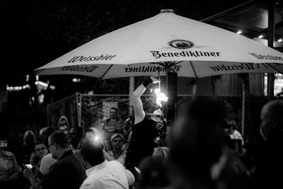 People on street in city at night