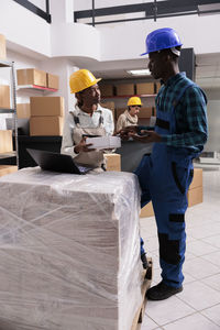 Rear view of man working at construction site