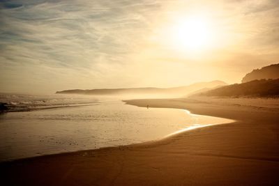 Scenic view of sea at sunset