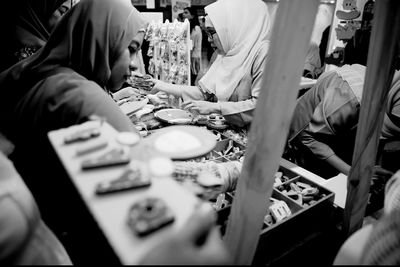 Close-up of people trading at market