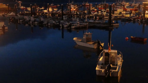 High angle view of sailboats moored at harbor