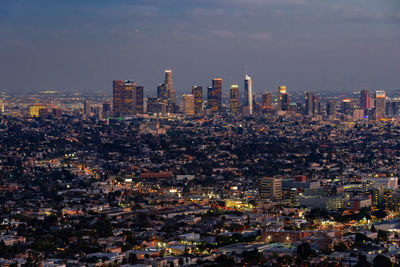 City against sky during sunset