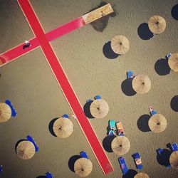 Aerial view of parasols at beach on sunny day