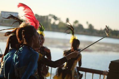 Women wearing traditional clothing taking selfie