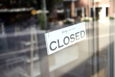 Close-up of text on glass window