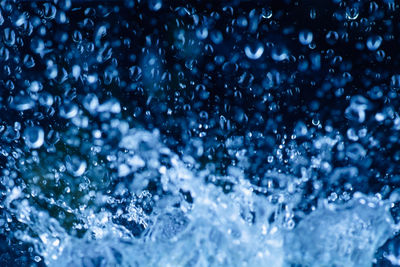 Full frame shot of wet glass during winter