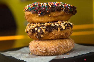 Close-up of donut stacks on tissue paper