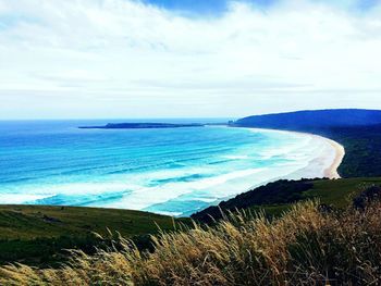 Scenic view of sea against cloudy sky