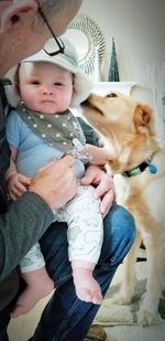 Full length of cute baby with cat