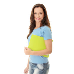 Portrait of smiling woman standing against white background