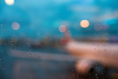 Full frame shot of wet glass window in an airport