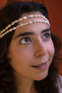 Close-up portrait of a smiling young woman