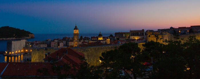 Illuminated buildings in city at night