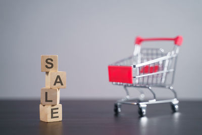 Close-up of toys on table against white background