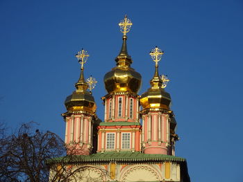 Low angle view of a building against blue sky