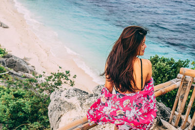 Rear view of woman looking at sea