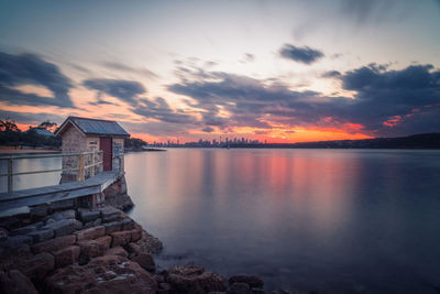 Scenic view of lake against sky during sunset