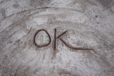 High angle view of heart shape on sand