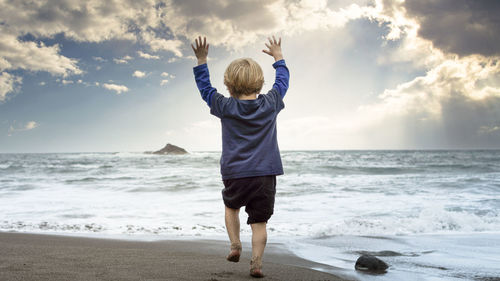 Small child playing on the beach