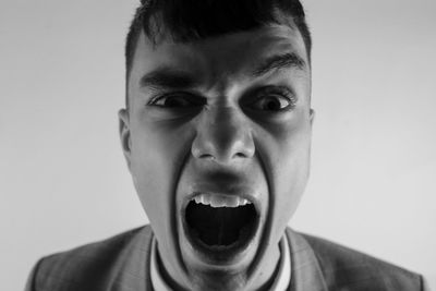 Close-up portrait of man screaming