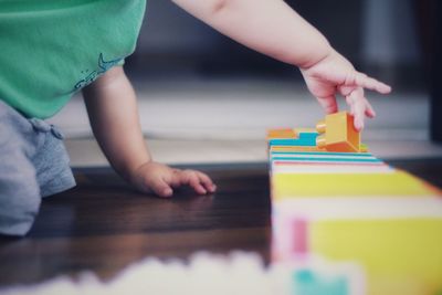 Boy playing with toy at home