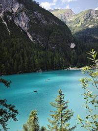 Scenic view of sea and mountains against sky