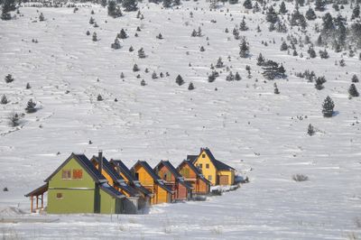 Built structures on snow covered mountain