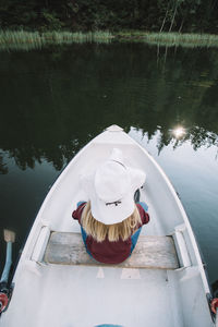 High angle view of swan on boat in lake