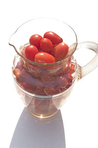 Close-up of drink in glass against white background