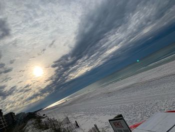 Scenic view of snow covered land against sky during sunset