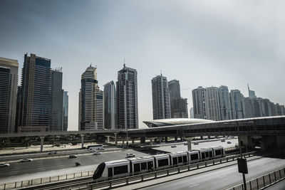 Modern buildings in city against sky