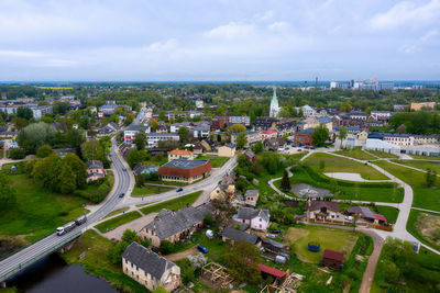 Aerial view of the dobele city, industrial and residential buildings, streets and parks, latvia