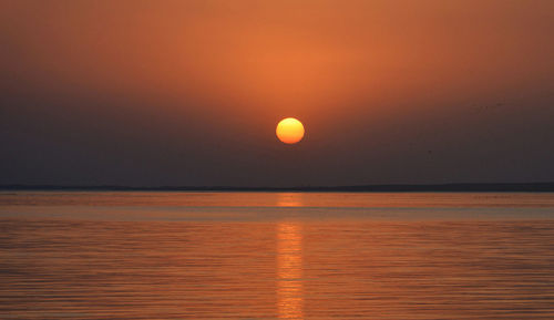 Scenic view of sea against sky during sunset