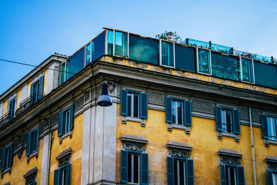 Low angle view of building against blue sky