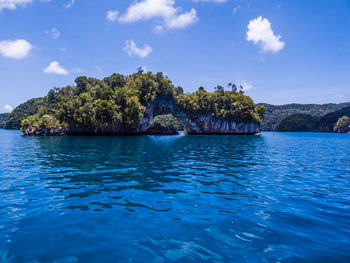 Scenic view of sea against blue sky