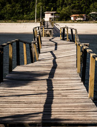 Shadow of railing on footpath