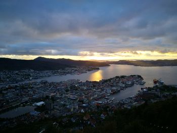 High angle view of cityscape by sea against sky