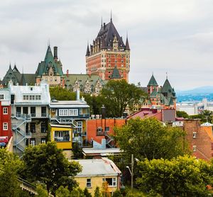 View of buildings against cloudy sky