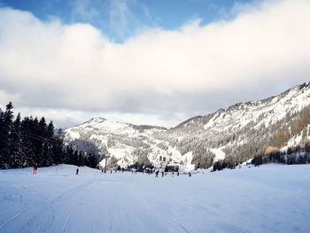 Scenic view of snowcapped mountains against sky