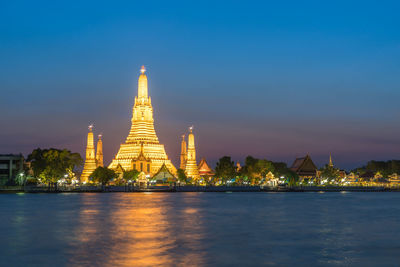 View of illuminated buildings at waterfront