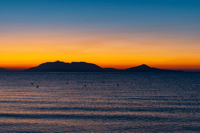 Sunrise at 6 o'clock in the morning from the beach on the mediterranean in front of kos greece