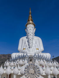 Low angle view of temple against building