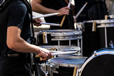 Section of a marching band drum line performing